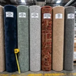 rolled carpet rolls showing standard carpet width in a flooring warehouse