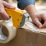 industrial clear tape sealing a cardboard moving box