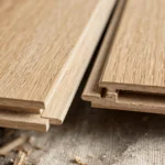 close up of laminate flooring tongue and groove edges before locking