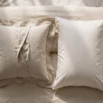 Side-by-side comparison of a bordered pillow sham and a plain pillowcase on a neatly made bed